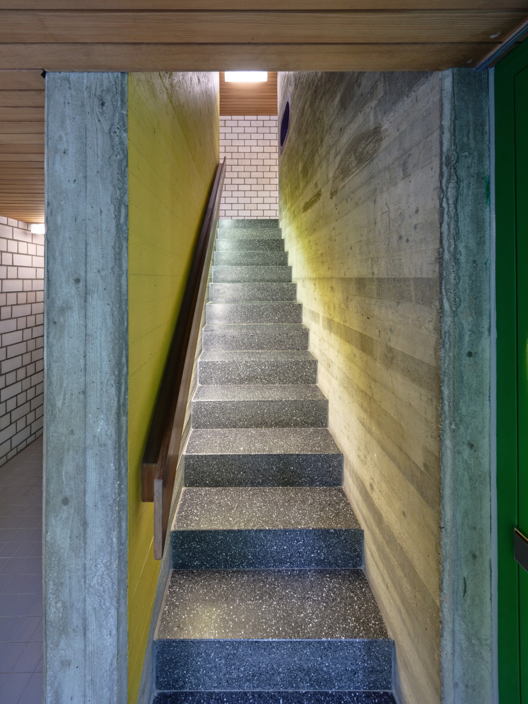 Stairs to the upper floor with lighting in the handrail